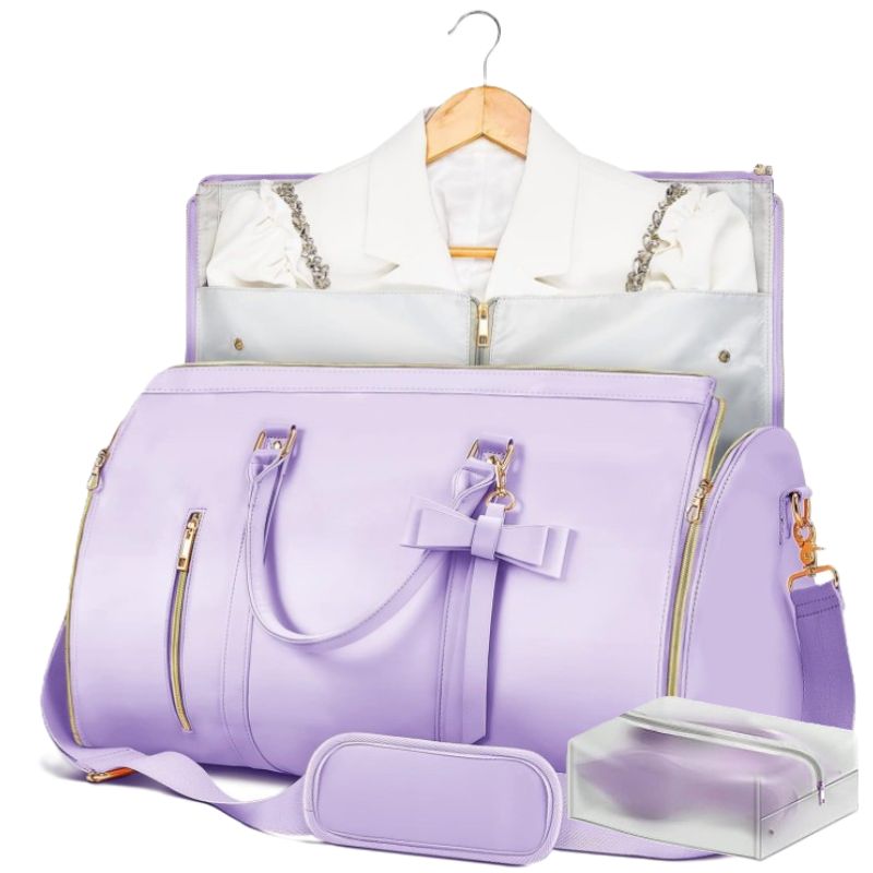A lavender purple travel duffel bag set with gold zippers, shown with a matching garment bag containing a white shirt and a small zippered pouch on a white background.